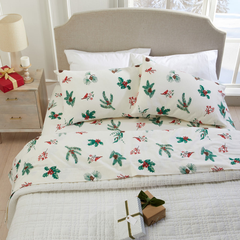 Printed 100% Turkish cotton flannel sheet set featuring assorted winter-inspired patterns, including woodland animals, snowflakes, trees, plaids, and seasonal motifs. Soft, cozy bedding shown in styled bedroom settings with close-up fabric details and folded sheet stacks in multiple designs.