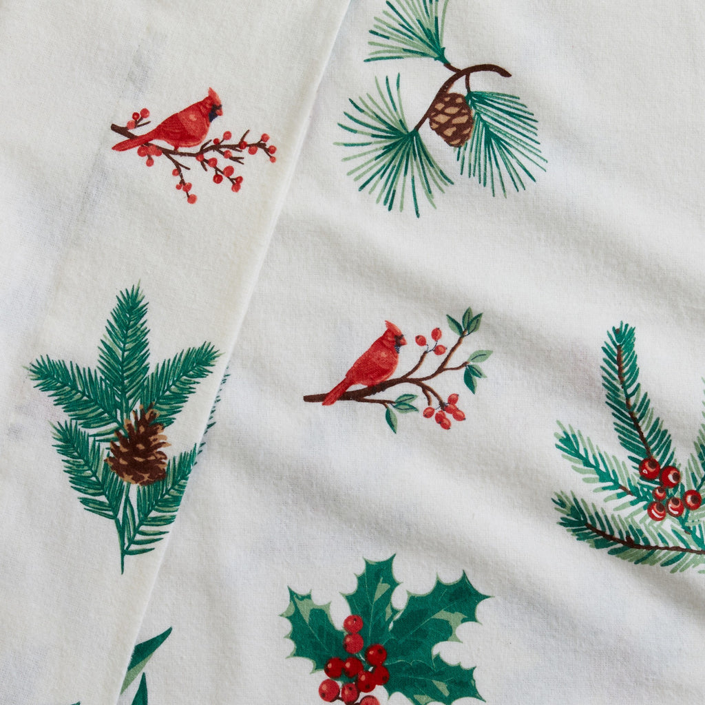 Printed 100% Turkish cotton flannel sheet set featuring assorted winter-inspired patterns, including woodland animals, snowflakes, trees, plaids, and seasonal motifs. Soft, cozy bedding shown in styled bedroom settings with close-up fabric details and folded sheet stacks in multiple designs.