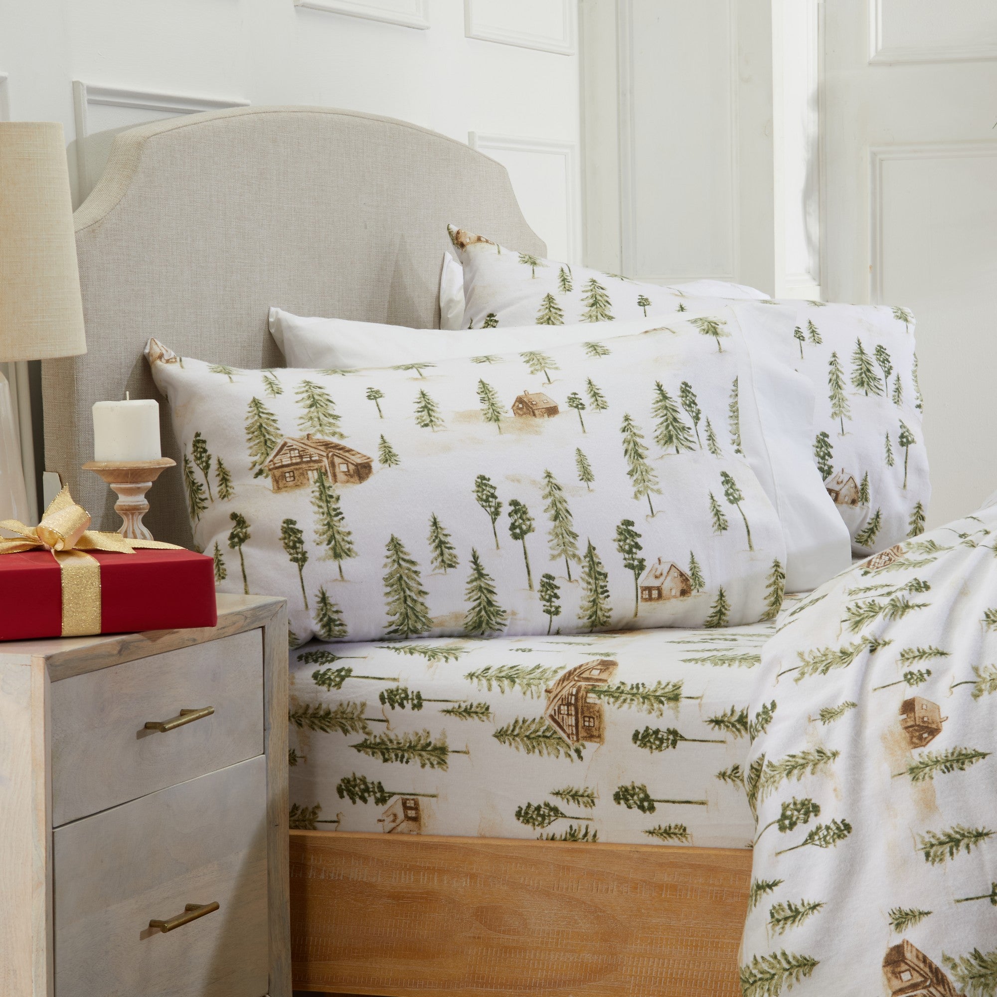 Printed 100% Turkish cotton flannel sheet set featuring assorted winter-inspired patterns, including woodland animals, snowflakes, trees, plaids, and seasonal motifs. Soft, cozy bedding shown in styled bedroom settings with close-up fabric details and folded sheet stacks in multiple designs.