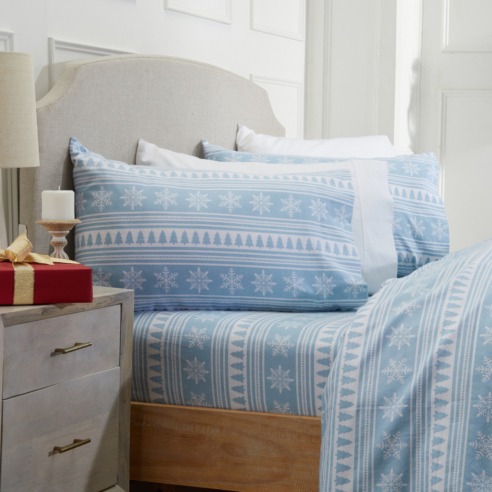 Printed 100% Turkish cotton flannel sheet set featuring assorted winter-inspired patterns, including woodland animals, snowflakes, trees, plaids, and seasonal motifs. Soft, cozy bedding shown in styled bedroom settings with close-up fabric details and folded sheet stacks in multiple designs.
