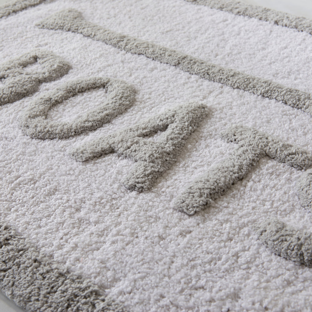 Textured doormat with 'BOATS' printed on it
