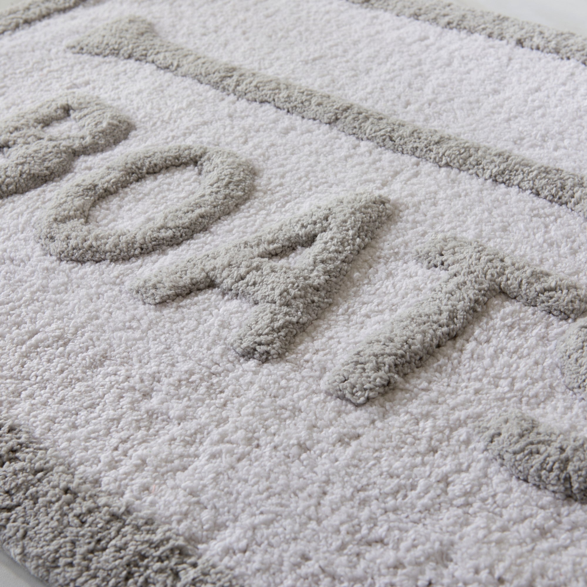 Textured doormat with 'BOATS' printed on it