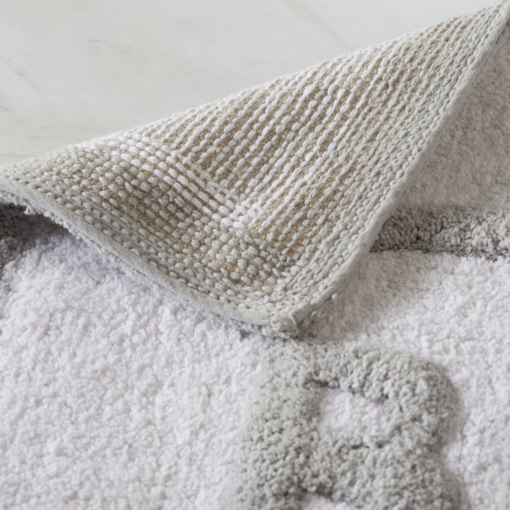 Textured blanket draped over a soft surface