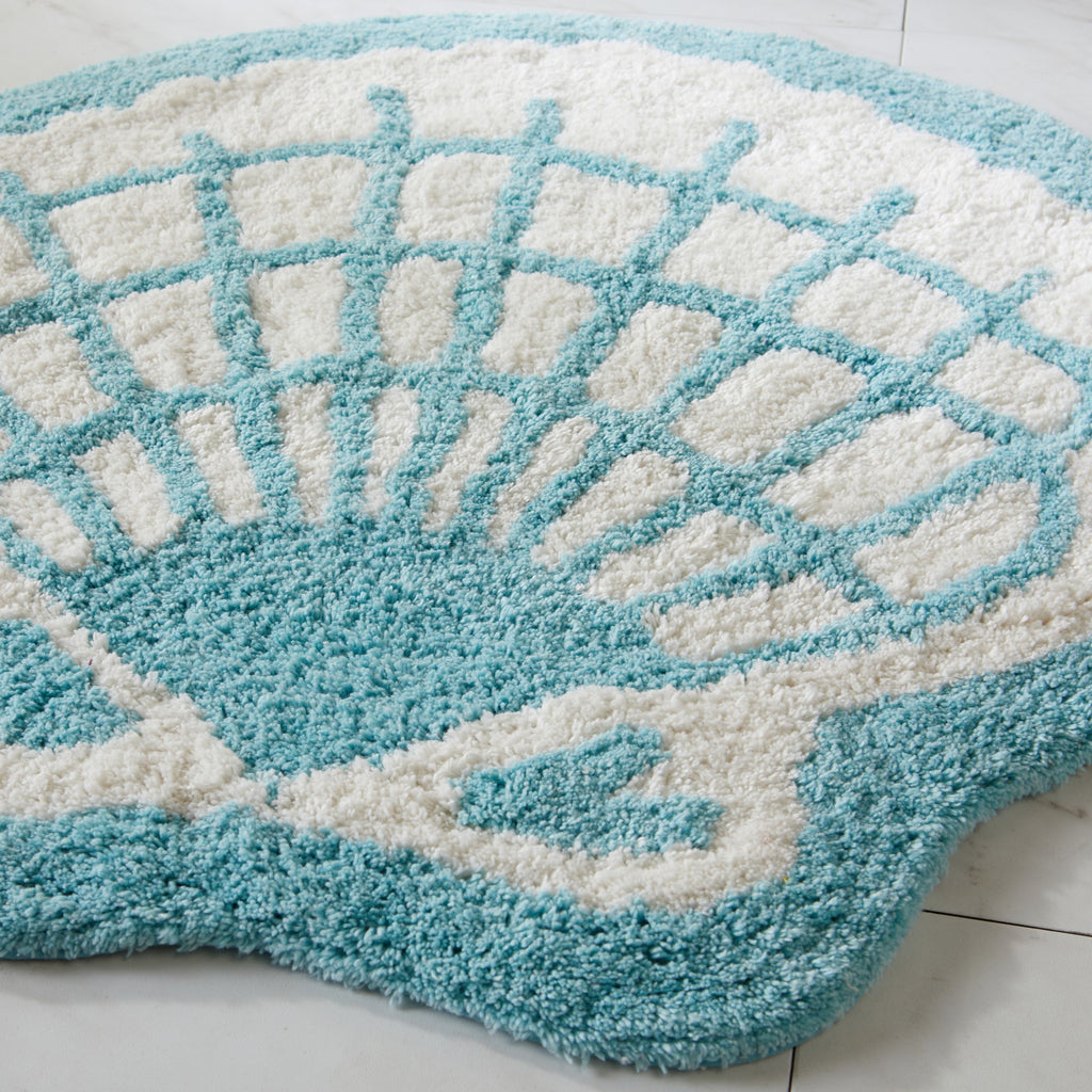 Blue and white textured rug on a light wooden floor
