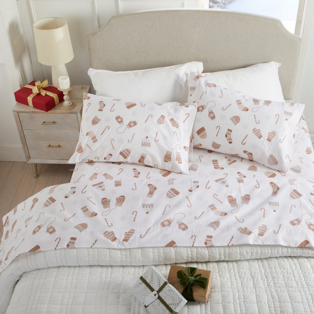 Bedding set with footprints on a bed in a bedroom setting