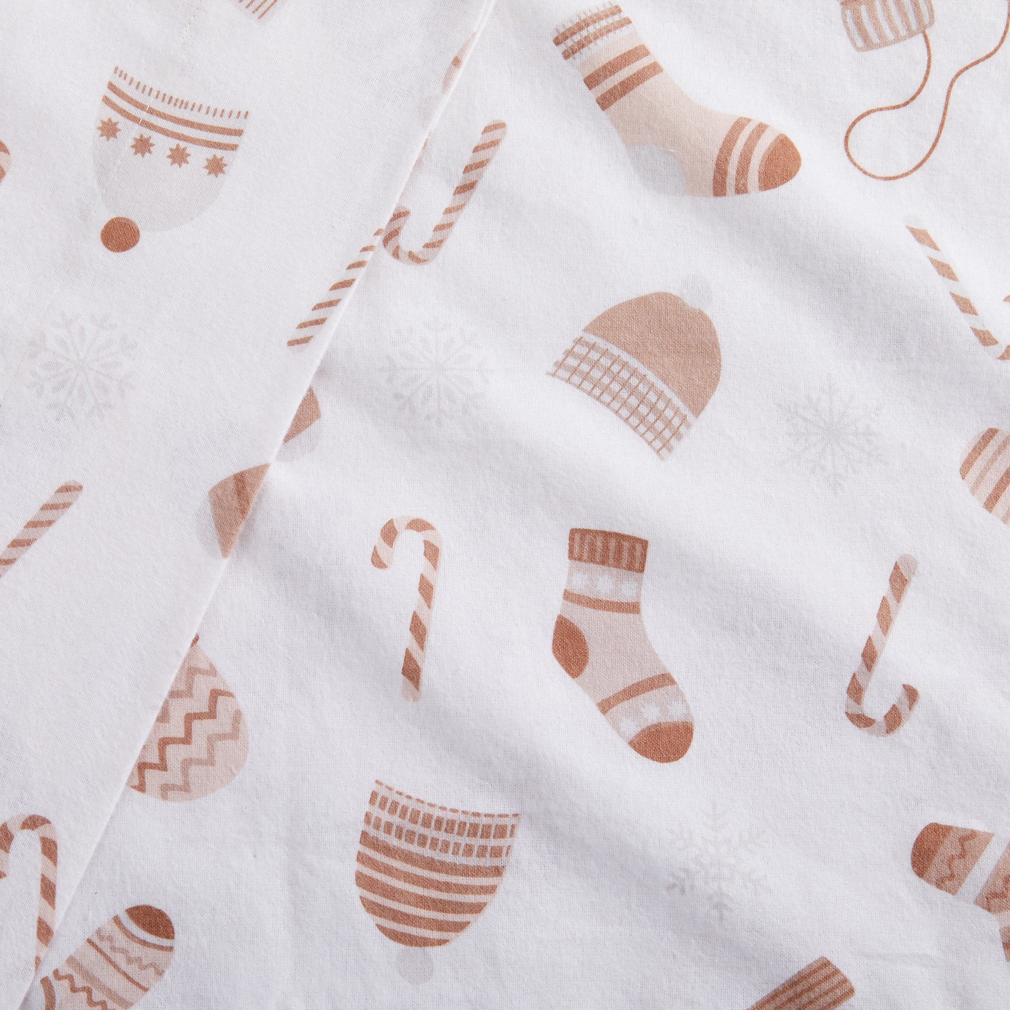 White fabric with brown sock and candy cane pattern