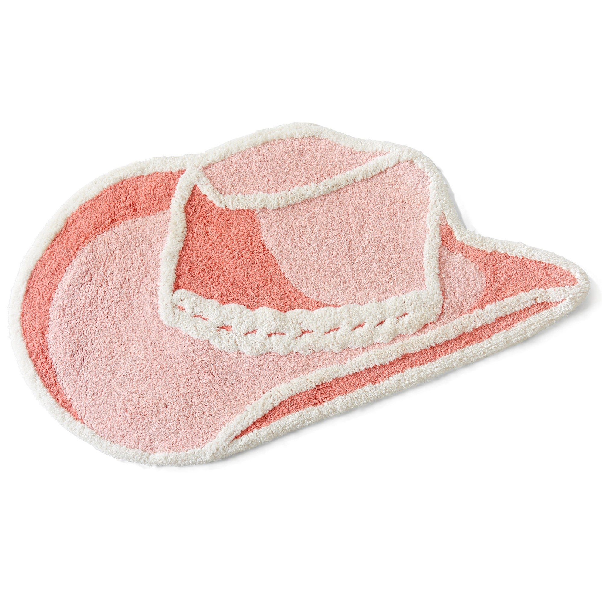 Pink cowboy hat-shaped bath mat on a white background
