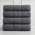 Harper Collection Waffle Textured Bath Towels by Market & Place featuring premium 100% cotton construction with a stylish waffle weave texture. Available in multiple colors and set configurations, including bath towels, hand towels, and washcloths, shown folded, stacked, and styled to highlight their soft, plush, and highly absorbent design.