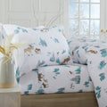 Printed 100% Turkish cotton flannel sheet set featuring assorted winter-inspired patterns, including woodland animals, snowflakes, trees, plaids, and seasonal motifs. Soft, cozy bedding shown in styled bedroom settings with close-up fabric details and folded sheet stacks in multiple designs.