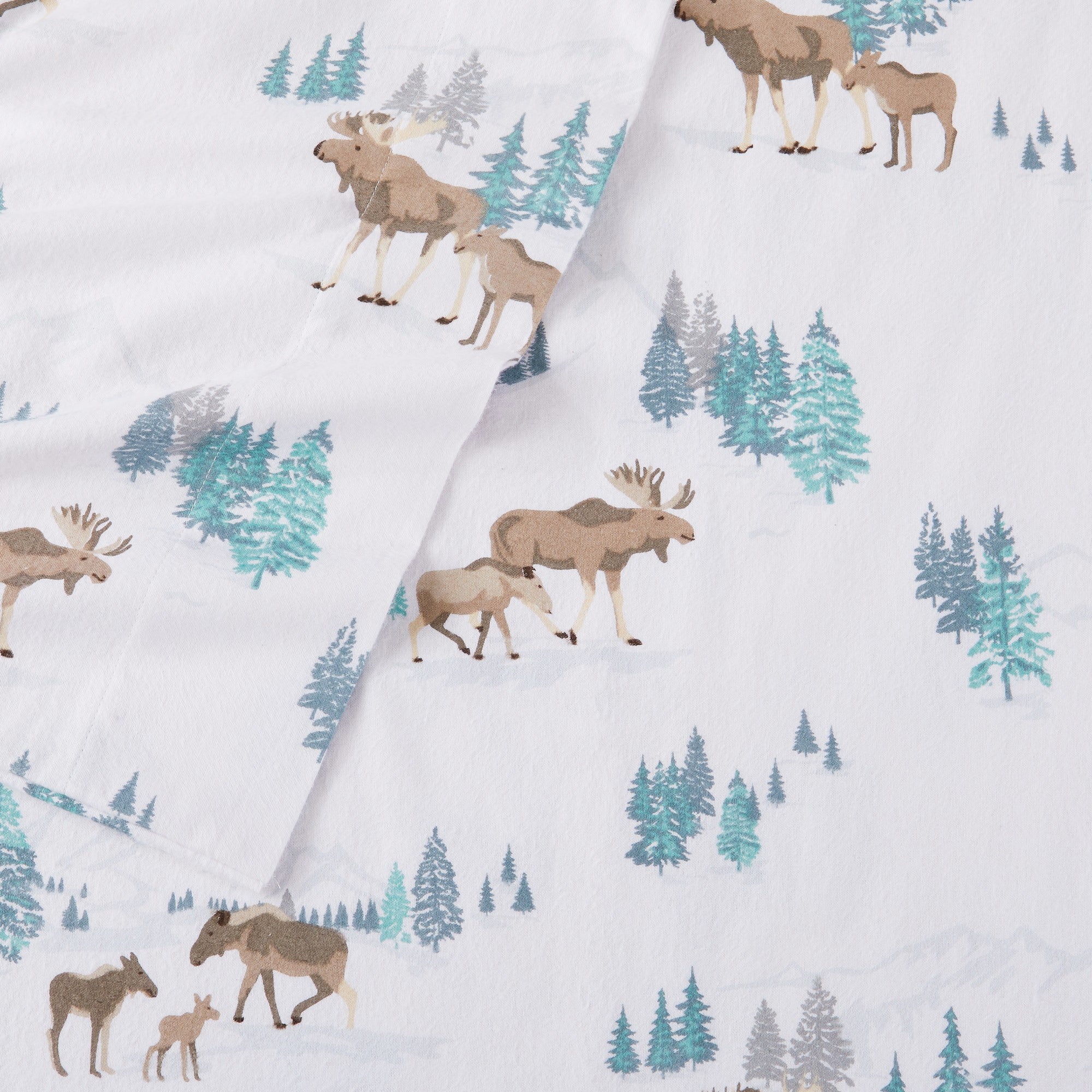 Printed 100% Turkish cotton flannel sheet set featuring assorted winter-inspired patterns, including woodland animals, snowflakes, trees, plaids, and seasonal motifs. Soft, cozy bedding shown in styled bedroom settings with close-up fabric details and folded sheet stacks in multiple designs.