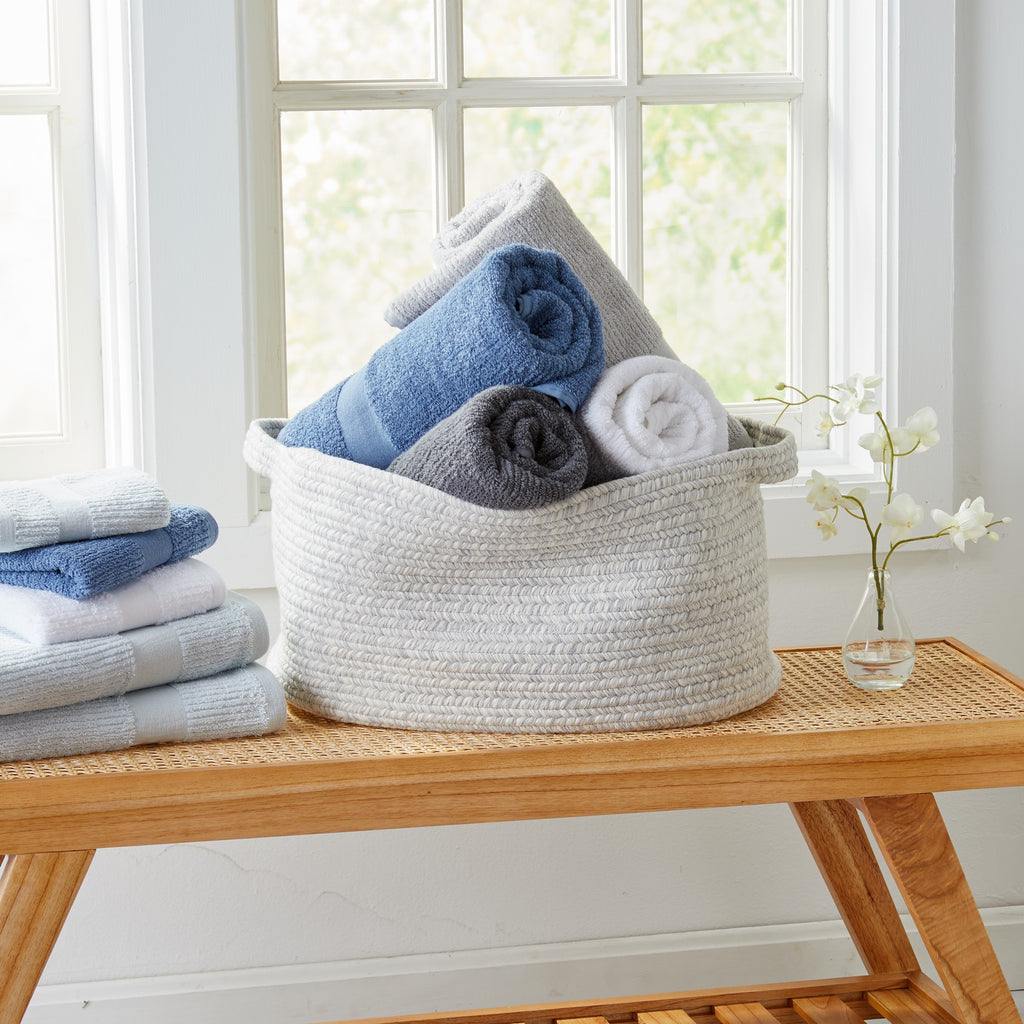 Roda Collection Cotton Ribbed Bath Towels by Market & Place featuring premium 100% cotton construction with a textured ribbed weave. Available in multiple colors and set configurations, including bath towels, hand towels, and washcloths, shown folded, stacked, and styled to highlight their soft, plush, and highly absorbent design.