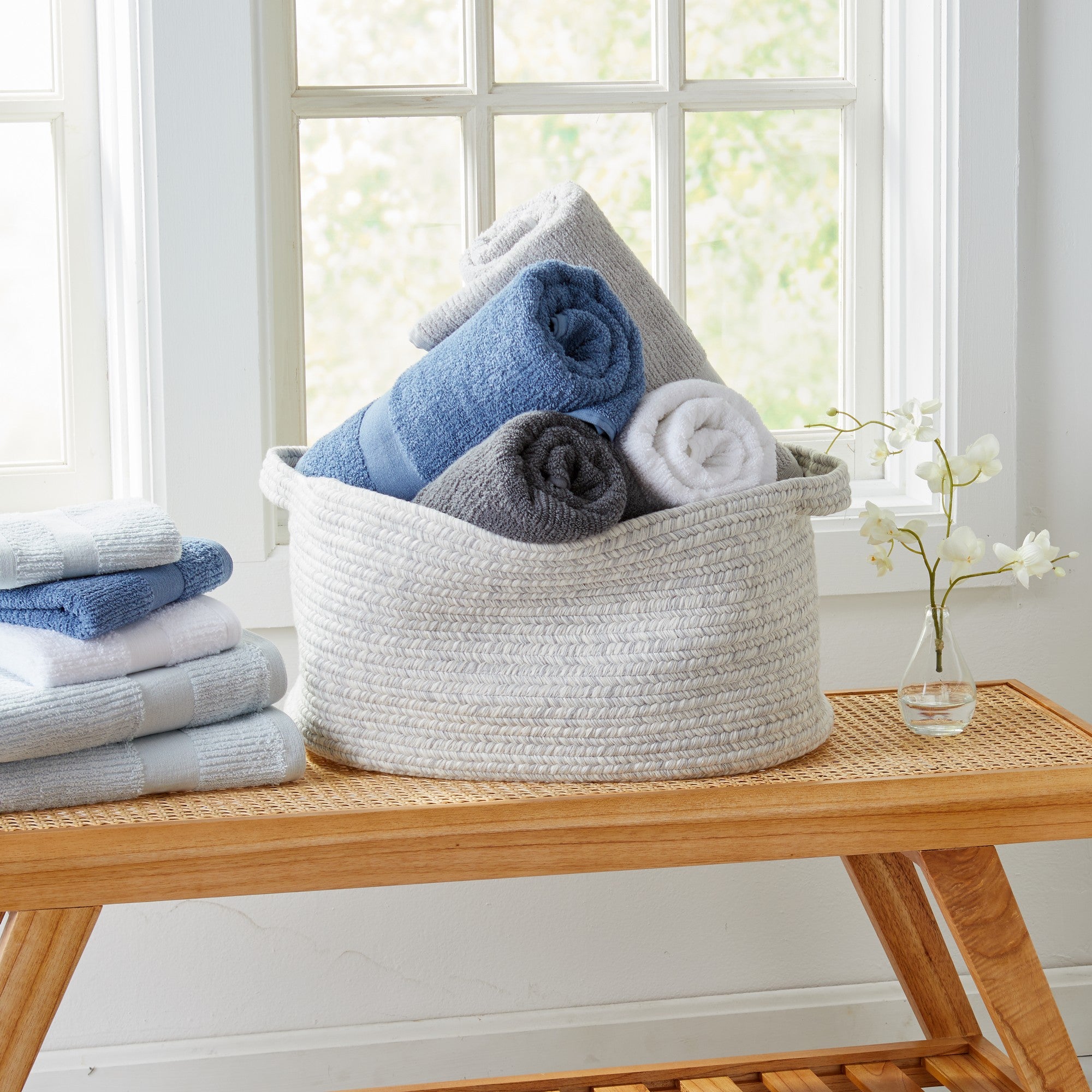 Roda Collection Cotton Ribbed Bath Towels by Market & Place featuring premium 100% cotton construction with a textured ribbed weave. Available in multiple colors and set configurations, including bath towels, hand towels, and washcloths, shown folded, stacked, and styled to highlight their soft, plush, and highly absorbent design.