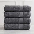 Roda Collection Cotton Ribbed Bath Towels by Market & Place featuring premium 100% cotton construction with a textured ribbed weave. Available in multiple colors and set configurations, including bath towels, hand towels, and washcloths, shown folded, stacked, and styled to highlight their soft, plush, and highly absorbent design.