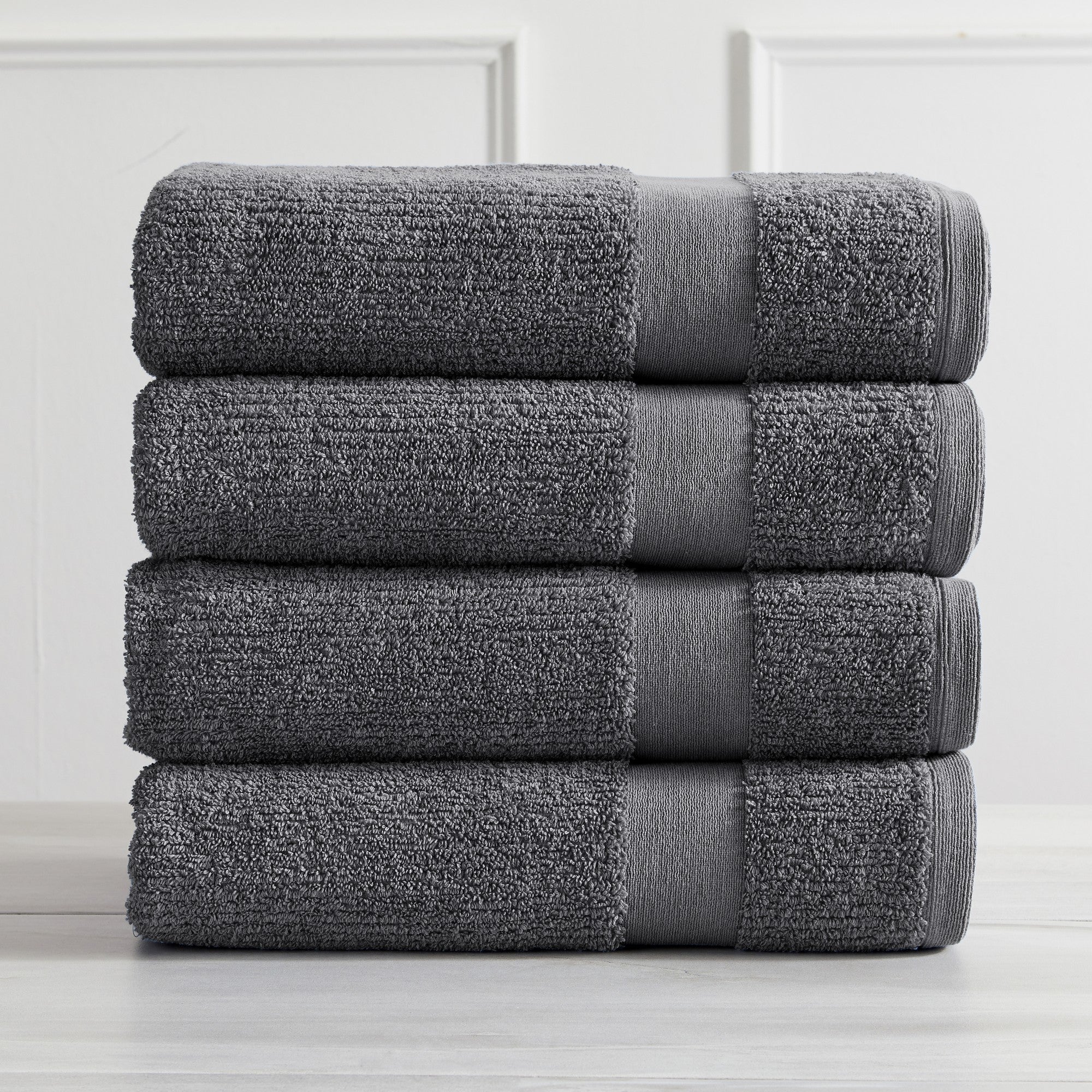 Roda Collection Cotton Ribbed Bath Towels by Market & Place featuring premium 100% cotton construction with a textured ribbed weave. Available in multiple colors and set configurations, including bath towels, hand towels, and washcloths, shown folded, stacked, and styled to highlight their soft, plush, and highly absorbent design.