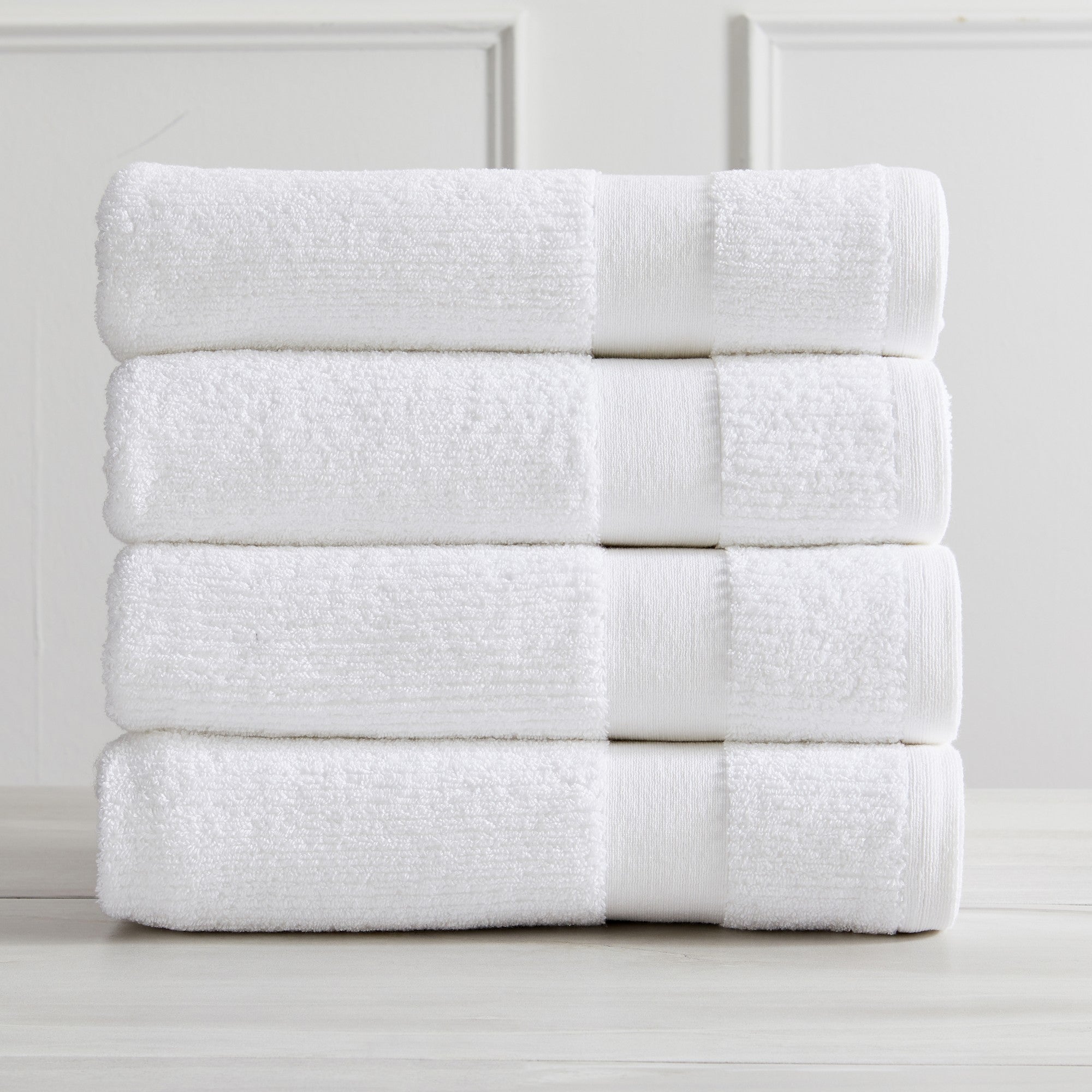 Roda Collection Cotton Ribbed Bath Towels by Market & Place featuring premium 100% cotton construction with a textured ribbed weave. Available in multiple colors and set configurations, including bath towels, hand towels, and washcloths, shown folded, stacked, and styled to highlight their soft, plush, and highly absorbent design.