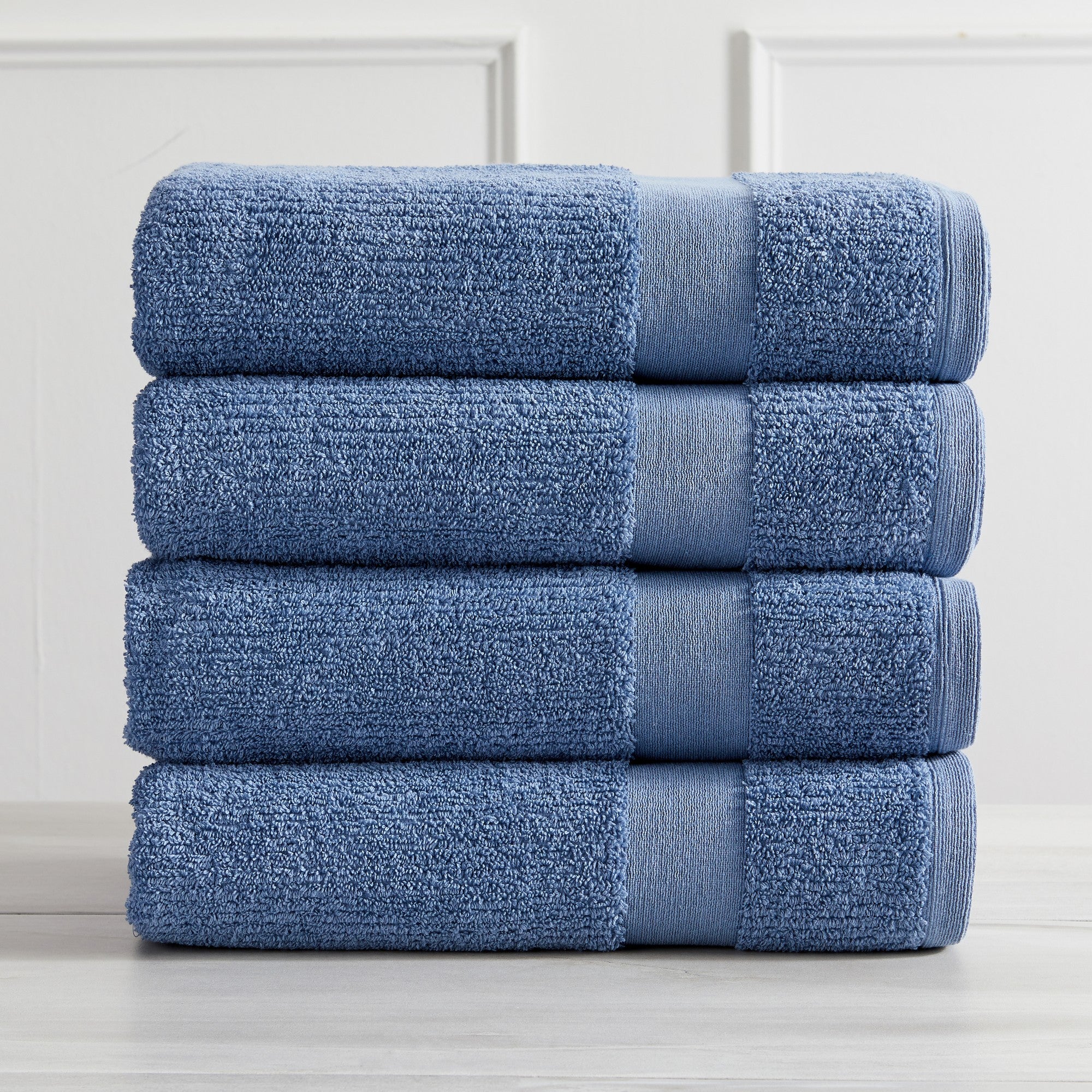 Roda Collection Cotton Ribbed Bath Towels by Market & Place featuring premium 100% cotton construction with a textured ribbed weave. Available in multiple colors and set configurations, including bath towels, hand towels, and washcloths, shown folded, stacked, and styled to highlight their soft, plush, and highly absorbent design.