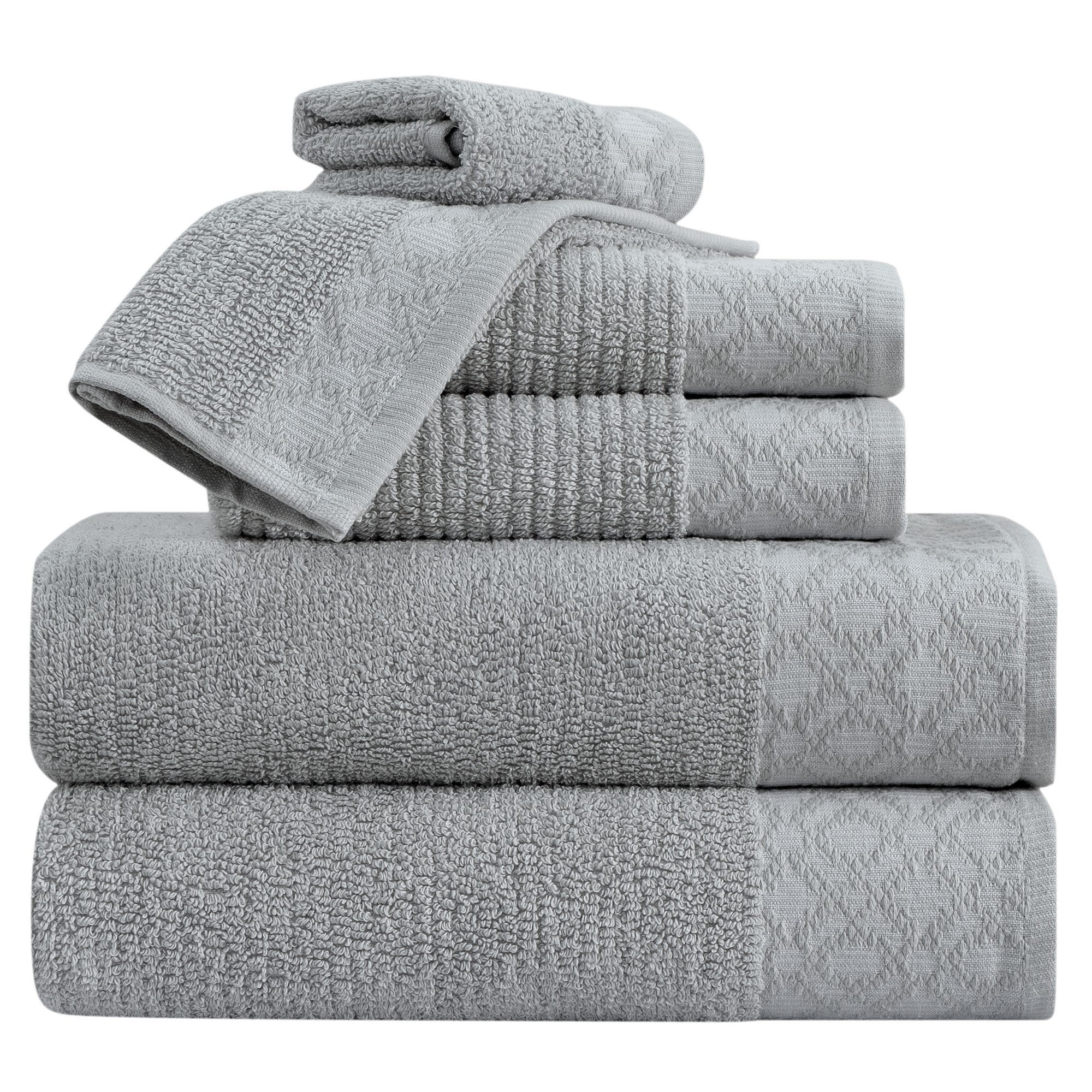 Nitra Collection Cotton Luxury Bath Towels by Market & Place featuring premium 100% cotton construction with an elegant geometric dobby border. Available in multiple colors and set configurations, including bath towels, hand towels, and washcloths, shown folded and stacked to highlight their soft, plush, and absorbent texture.