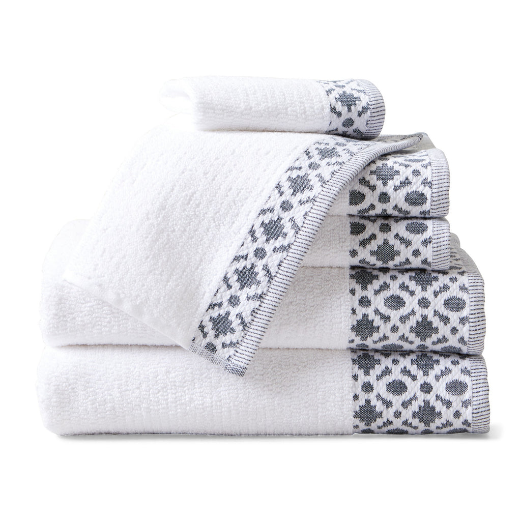 Nitra Collection Cotton Luxury Bath Towels by Market & Place featuring premium 100% cotton construction with an elegant geometric dobby border. Available in multiple colors and set configurations, including bath towels, hand towels, and washcloths, shown folded and stacked to highlight their soft, plush, and absorbent texture.