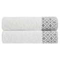 Nitra Collection Cotton Luxury Bath Towels by Market & Place featuring premium 100% cotton construction with an elegant geometric dobby border. Available in multiple colors and set configurations, including bath towels, hand towels, and washcloths, shown folded and stacked to highlight their soft, plush, and absorbent texture.