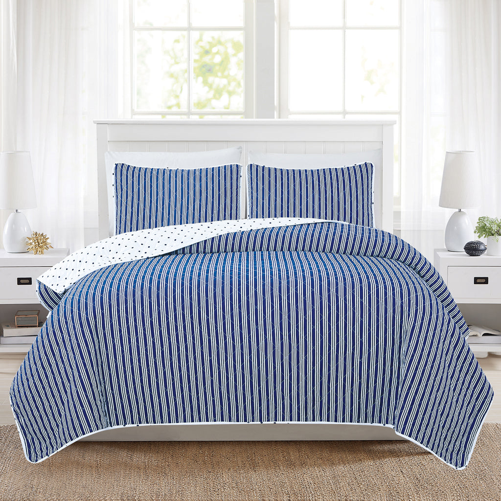 Nora Collection striped quilt set featuring classic striped patterns with a reversible dotted design, shown in multiple colorways and styling views. Soft, lightweight bedding with coordinating shams, displayed on beds and in close-up detail shots.