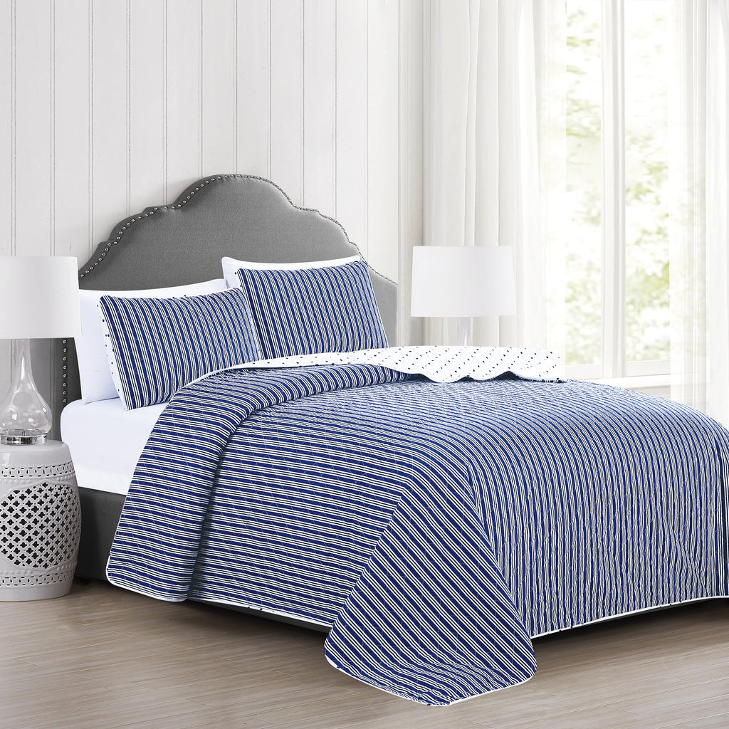 Nora Collection striped quilt set featuring classic striped patterns with a reversible dotted design, shown in multiple colorways and styling views. Soft, lightweight bedding with coordinating shams, displayed on beds and in close-up detail shots.