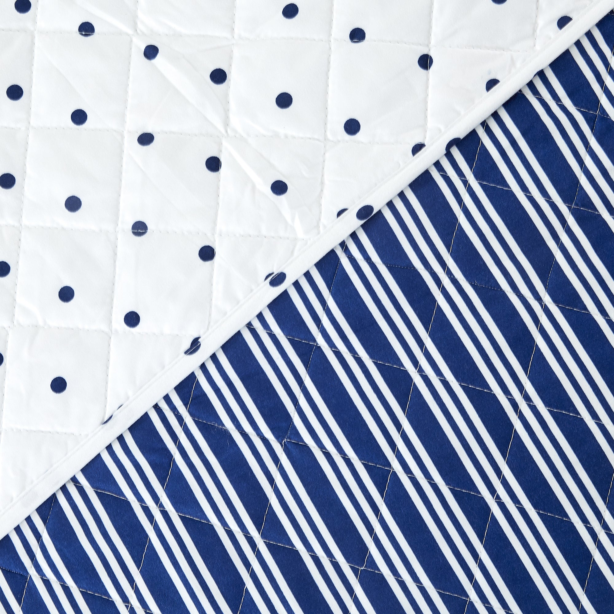 Nora Collection striped quilt set featuring classic striped patterns with a reversible dotted design, shown in multiple colorways and styling views. Soft, lightweight bedding with coordinating shams, displayed on beds and in close-up detail shots.