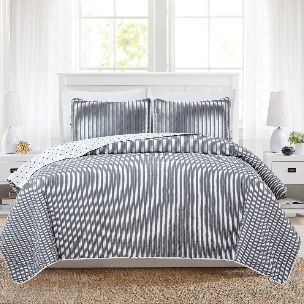 Nora Collection striped quilt set featuring classic striped patterns with a reversible dotted design, shown in multiple colorways and styling views. Soft, lightweight bedding with coordinating shams, displayed on beds and in close-up detail shots.