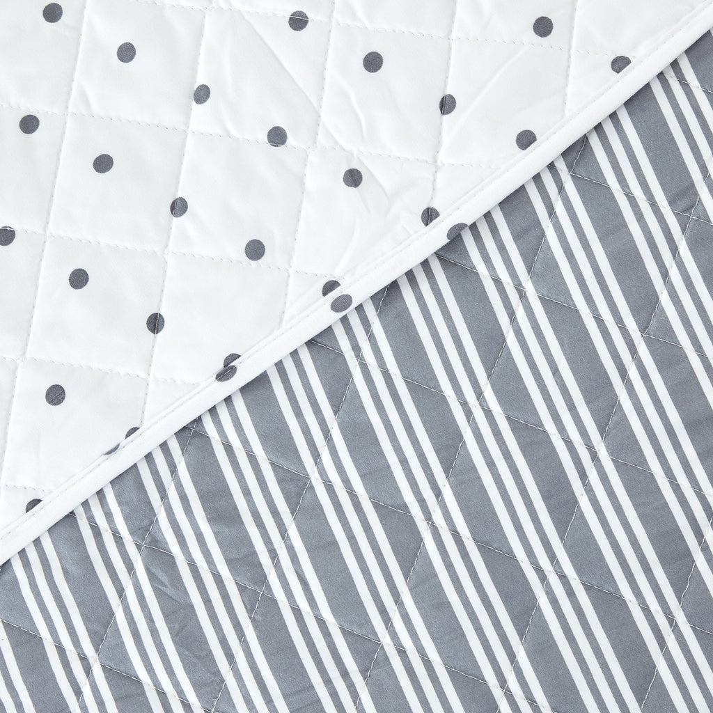 Nora Collection striped quilt set featuring classic striped patterns with a reversible dotted design, shown in multiple colorways and styling views. Soft, lightweight bedding with coordinating shams, displayed on beds and in close-up detail shots.
