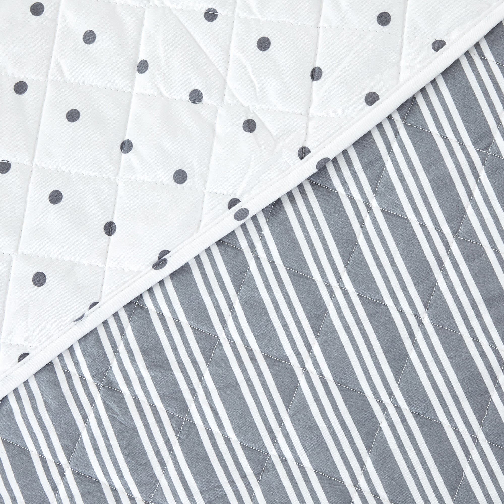 Nora Collection striped quilt set featuring classic striped patterns with a reversible dotted design, shown in multiple colorways and styling views. Soft, lightweight bedding with coordinating shams, displayed on beds and in close-up detail shots.