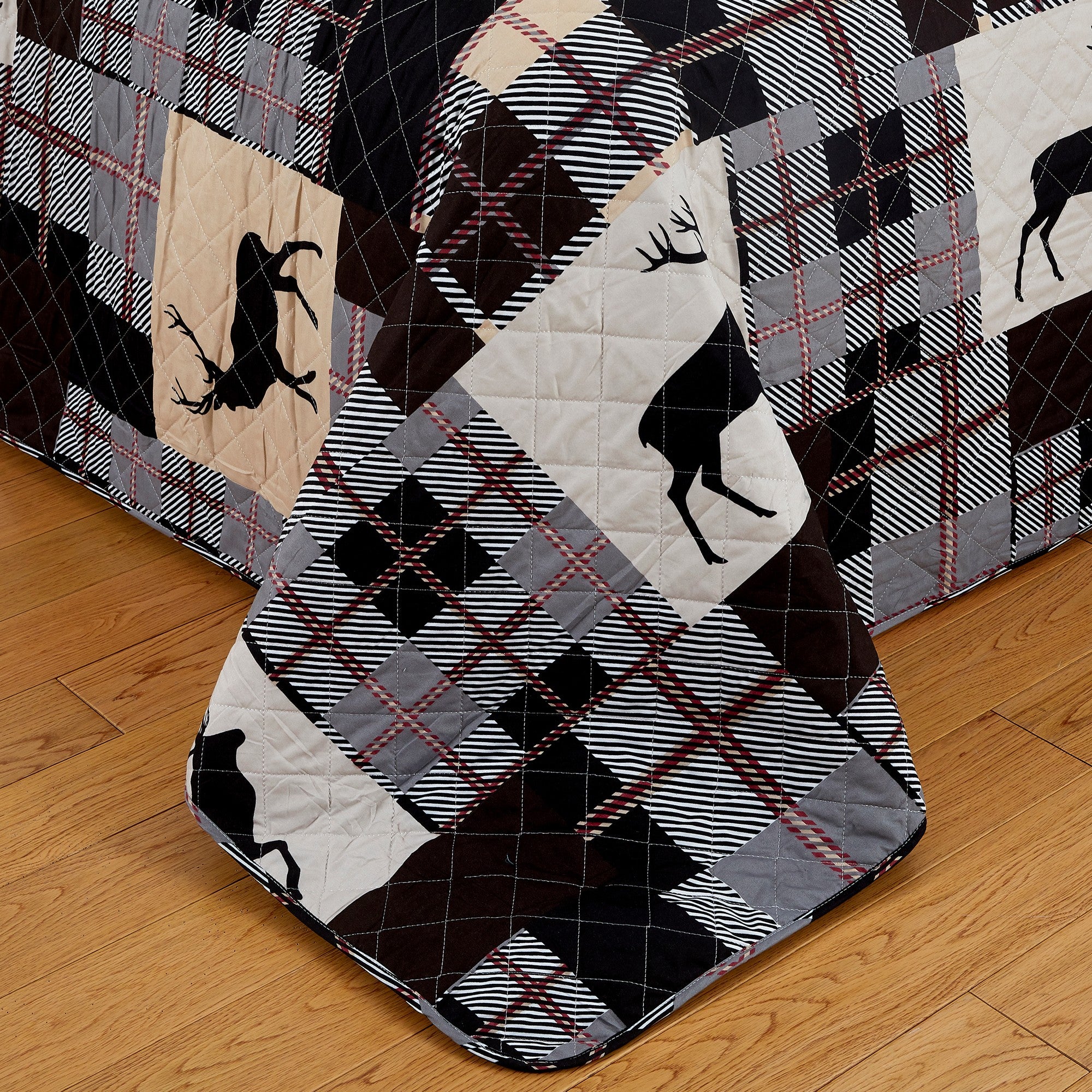 Everest Collection Lodge Quilt Set featuring rustic plaid patterns with deer motifs, shown in multiple styling views and close-up detail shots. Soft, reversible bedding with coordinating shams, designed to bring cozy cabin-inspired style and year-round comfort to the bedroom.