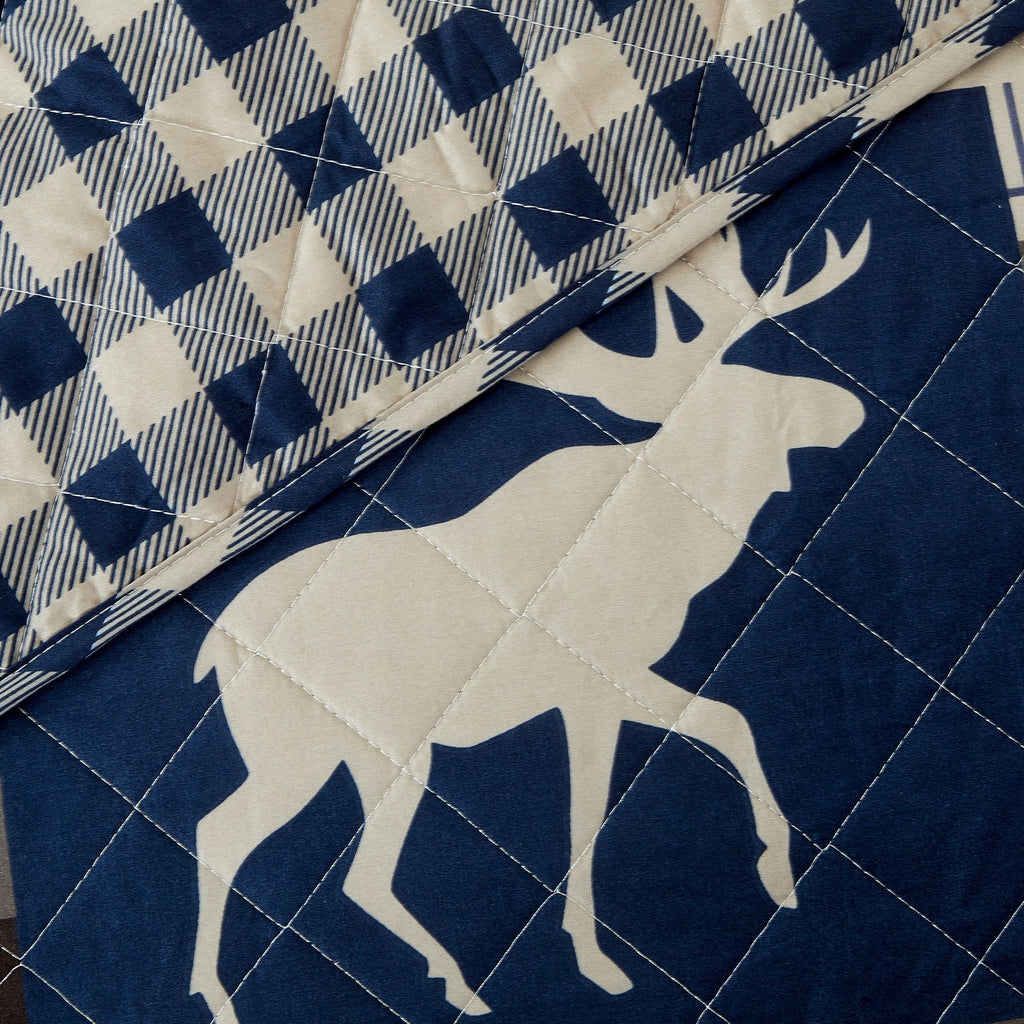 Reversible lodge quilt set featuring rustic plaid patterns and woodland-inspired motifs. Crafted with a soft microfiber shell and cotton-rich fill, this cozy bedding set includes matching sham(s) and brings cabin-inspired style to any bedroom.