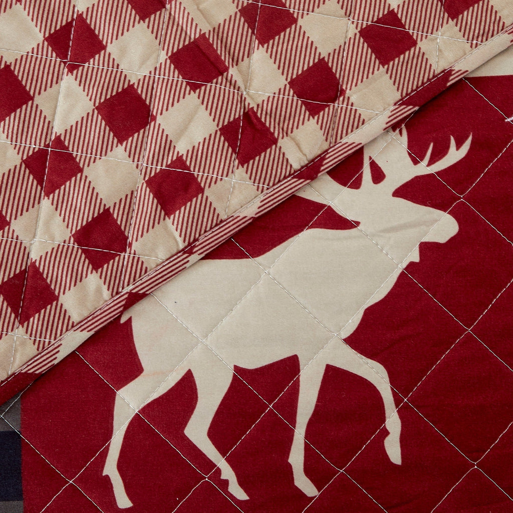 Reversible lodge quilt set featuring rustic plaid patterns and woodland-inspired motifs. Crafted with a soft microfiber shell and cotton-rich fill, this cozy bedding set includes matching sham(s) and brings cabin-inspired style to any bedroom.