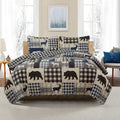 Redington Collection Bear Lodge Quilt Set featuring rustic patchwork designs with bear motifs and plaid patterns, shown in multiple colorways and styling views. Soft, reversible bedding with coordinating shams, displayed on beds and in close-up detail shots.