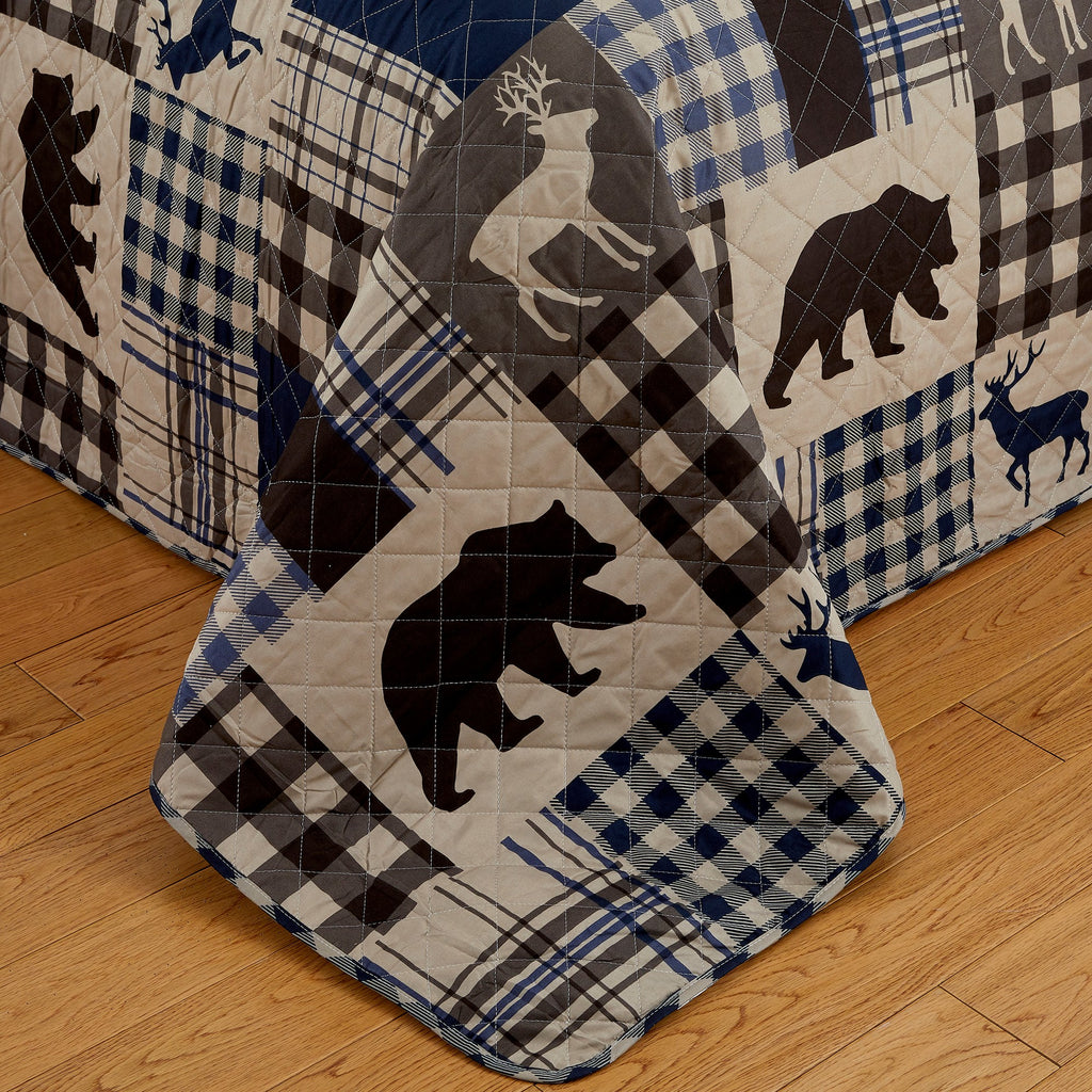 Redington Collection Bear Lodge Quilt Set featuring rustic patchwork designs with bear motifs and plaid patterns, shown in multiple colorways and styling views. Soft, reversible bedding with coordinating shams, displayed on beds and in close-up detail shots.