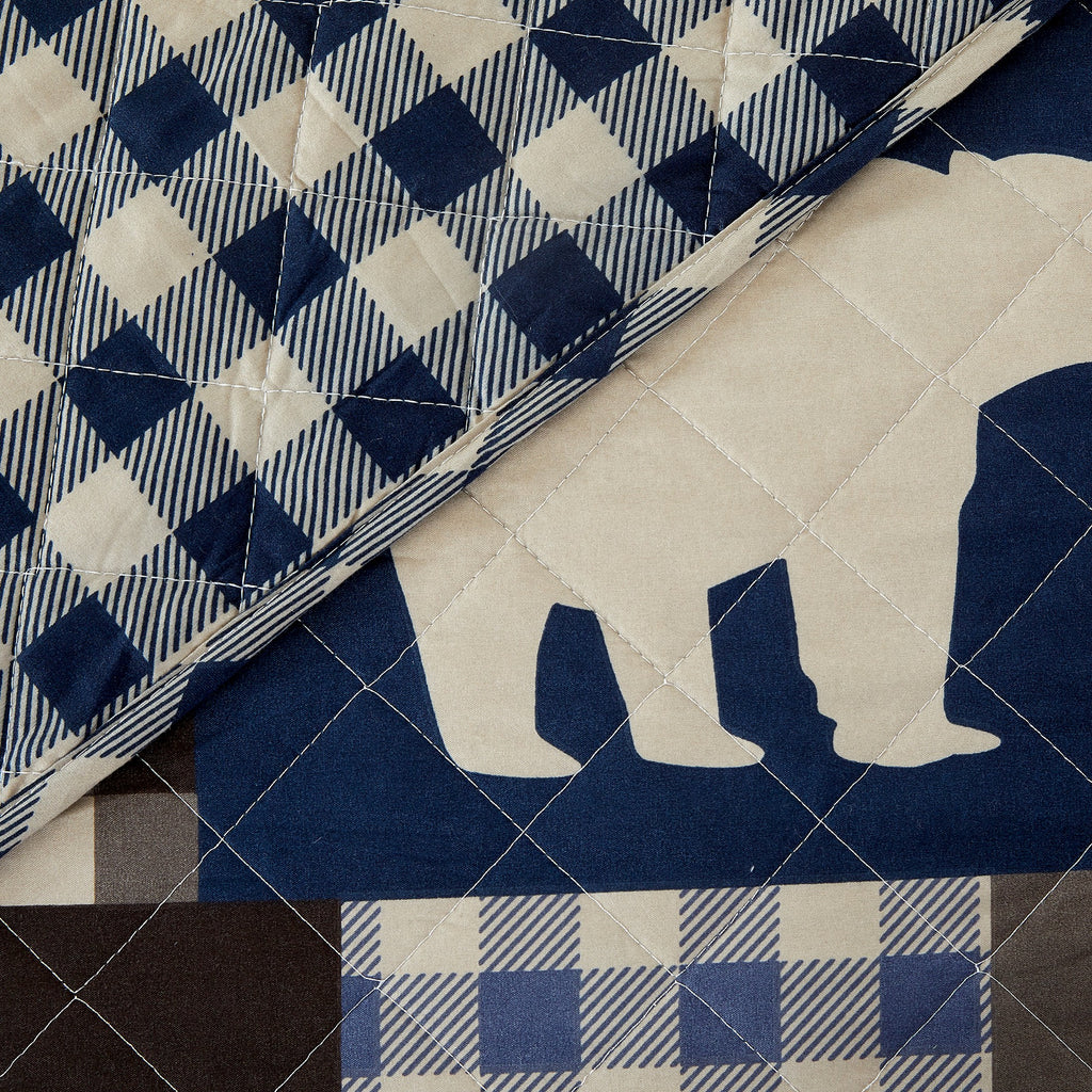 Redington Collection Bear Lodge Quilt Set featuring rustic patchwork designs with bear motifs and plaid patterns, shown in multiple colorways and styling views. Soft, reversible bedding with coordinating shams, displayed on beds and in close-up detail shots.