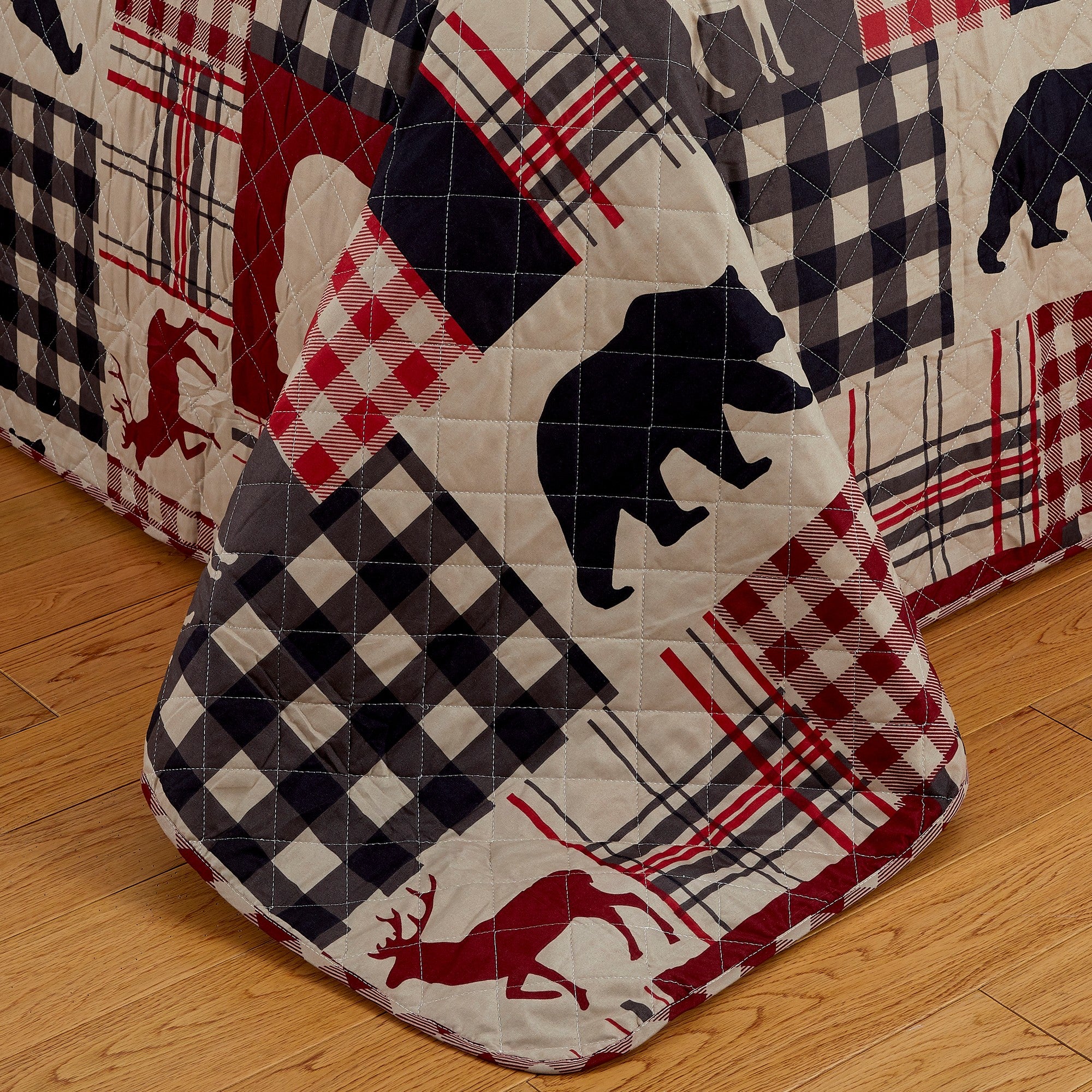 Redington Collection Bear Lodge Quilt Set featuring rustic patchwork designs with bear motifs and plaid patterns, shown in multiple colorways and styling views. Soft, reversible bedding with coordinating shams, displayed on beds and in close-up detail shots.