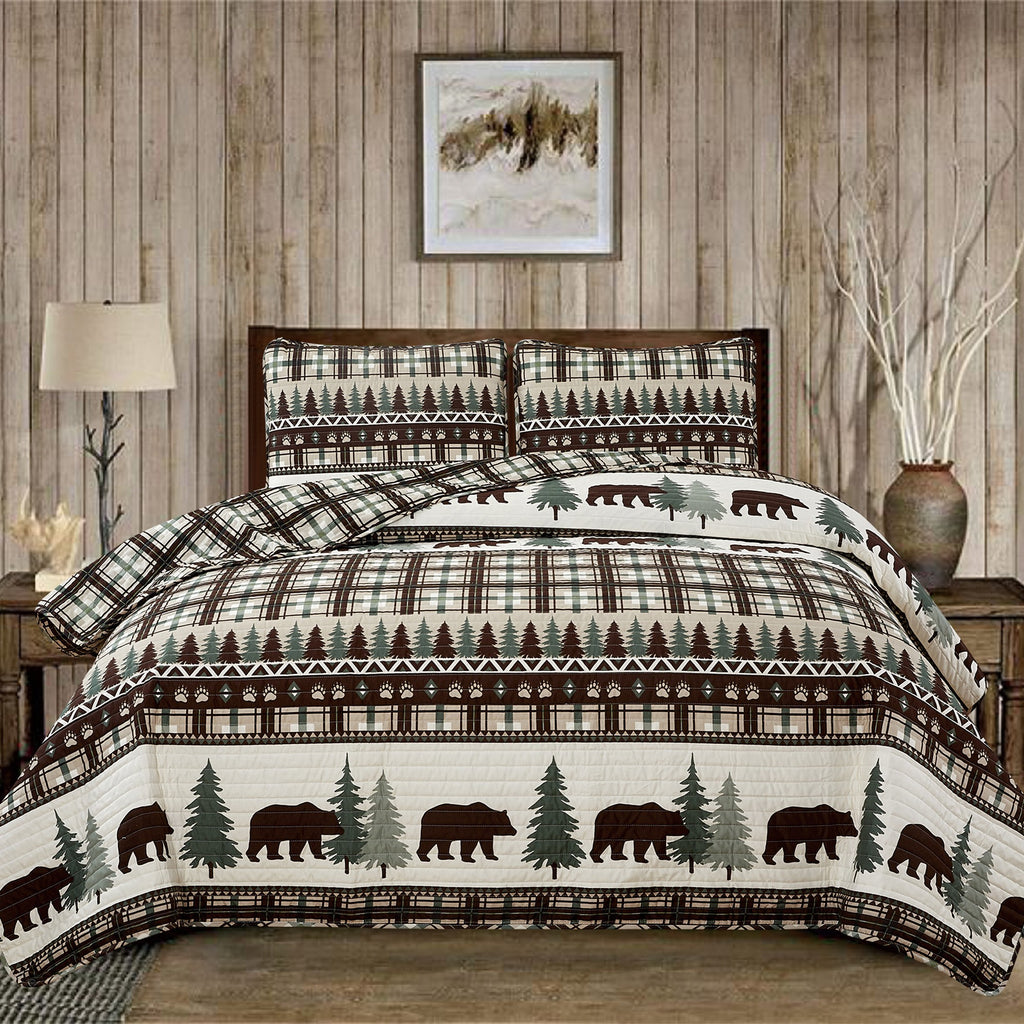 Cedar Creek Collection Lodge Quilt Set featuring rustic woodland-inspired patterns with bears, deer, trees, and plaid accents, shown in multiple colorways and styling views. Soft, reversible bedding with coordinating shams, displayed on beds and in close-up detail shots.