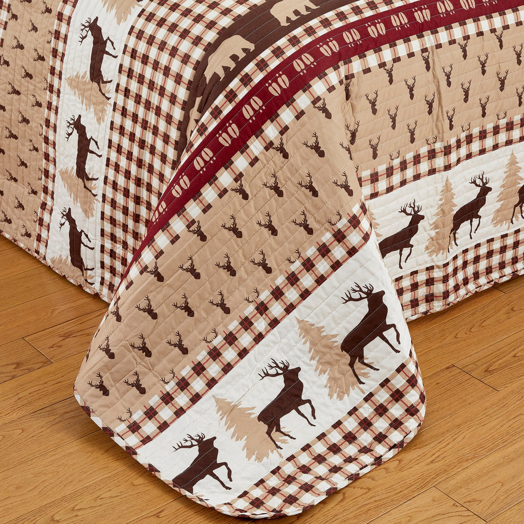 Cedar Creek Collection Lodge Quilt Set featuring rustic woodland-inspired patterns with bears, deer, trees, and plaid accents, shown in multiple colorways and styling views. Soft, reversible bedding with coordinating shams, displayed on beds and in close-up detail shots.