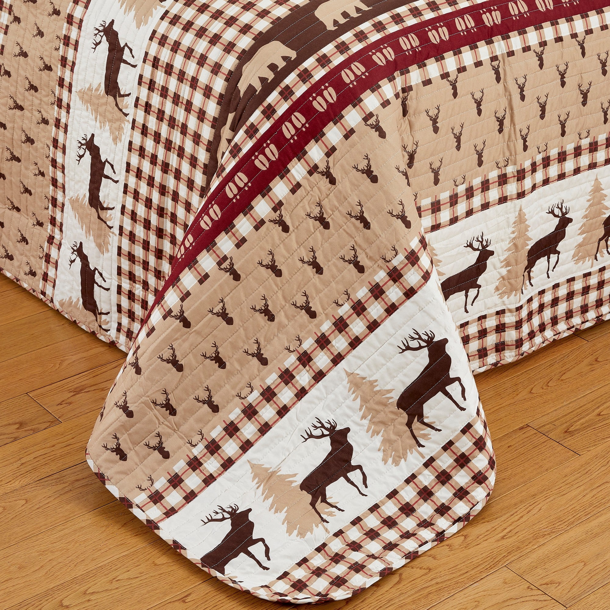 Cedar Creek Collection Lodge Quilt Set featuring rustic woodland-inspired patterns with bears, deer, trees, and plaid accents, shown in multiple colorways and styling views. Soft, reversible bedding with coordinating shams, displayed on beds and in close-up detail shots.