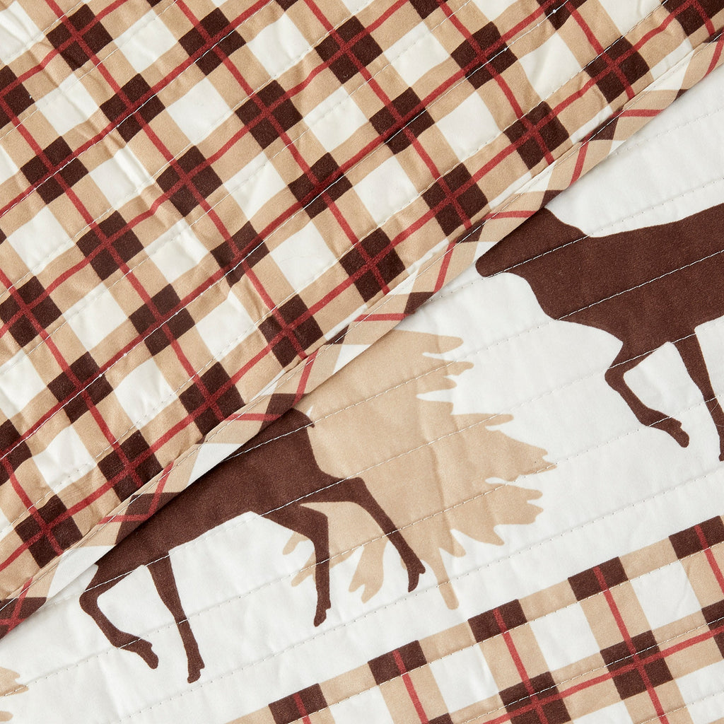 Cedar Creek Collection Lodge Quilt Set featuring rustic woodland-inspired patterns with bears, deer, trees, and plaid accents, shown in multiple colorways and styling views. Soft, reversible bedding with coordinating shams, displayed on beds and in close-up detail shots.