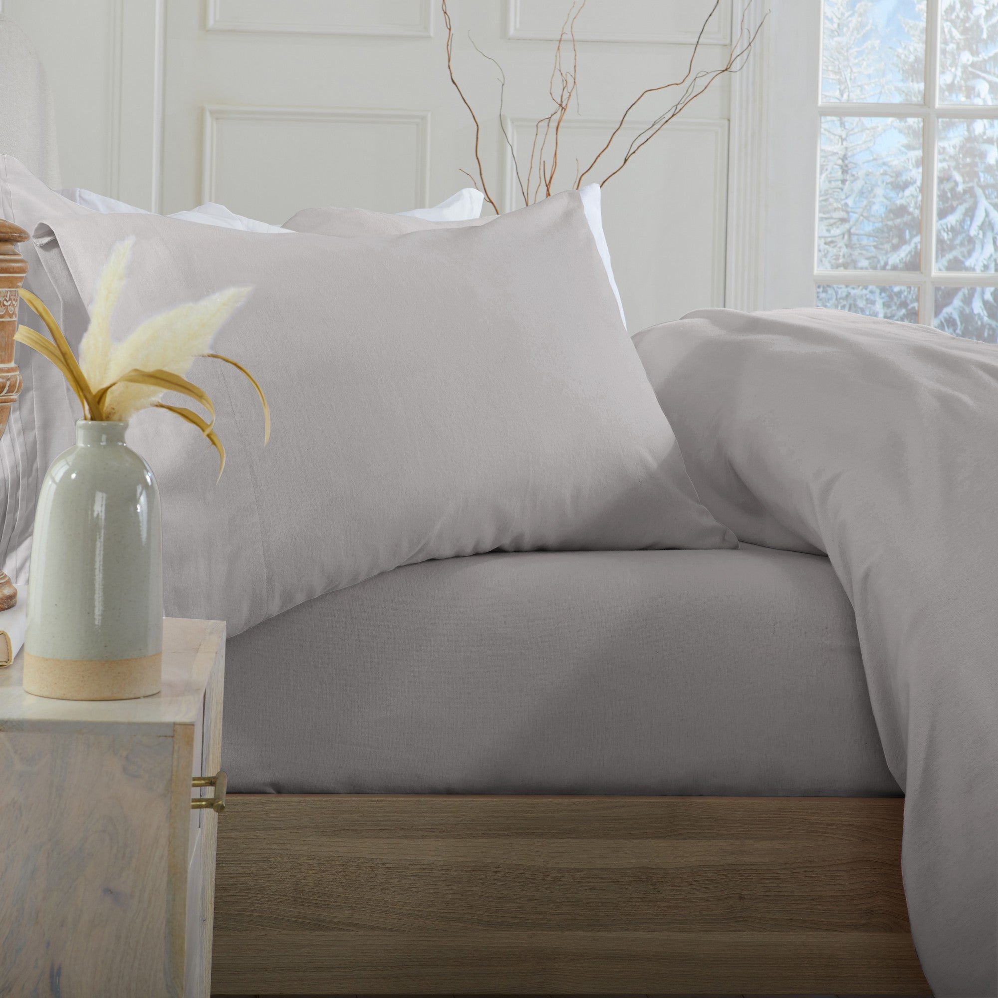 Chalet Collection Solid Flannel Sheet Set in assorted solid colors, featuring ultra-soft 100% Turkish cotton flannel bedding with coordinating pillowcases and fitted sheets, shown styled on beds and folded for detail views.