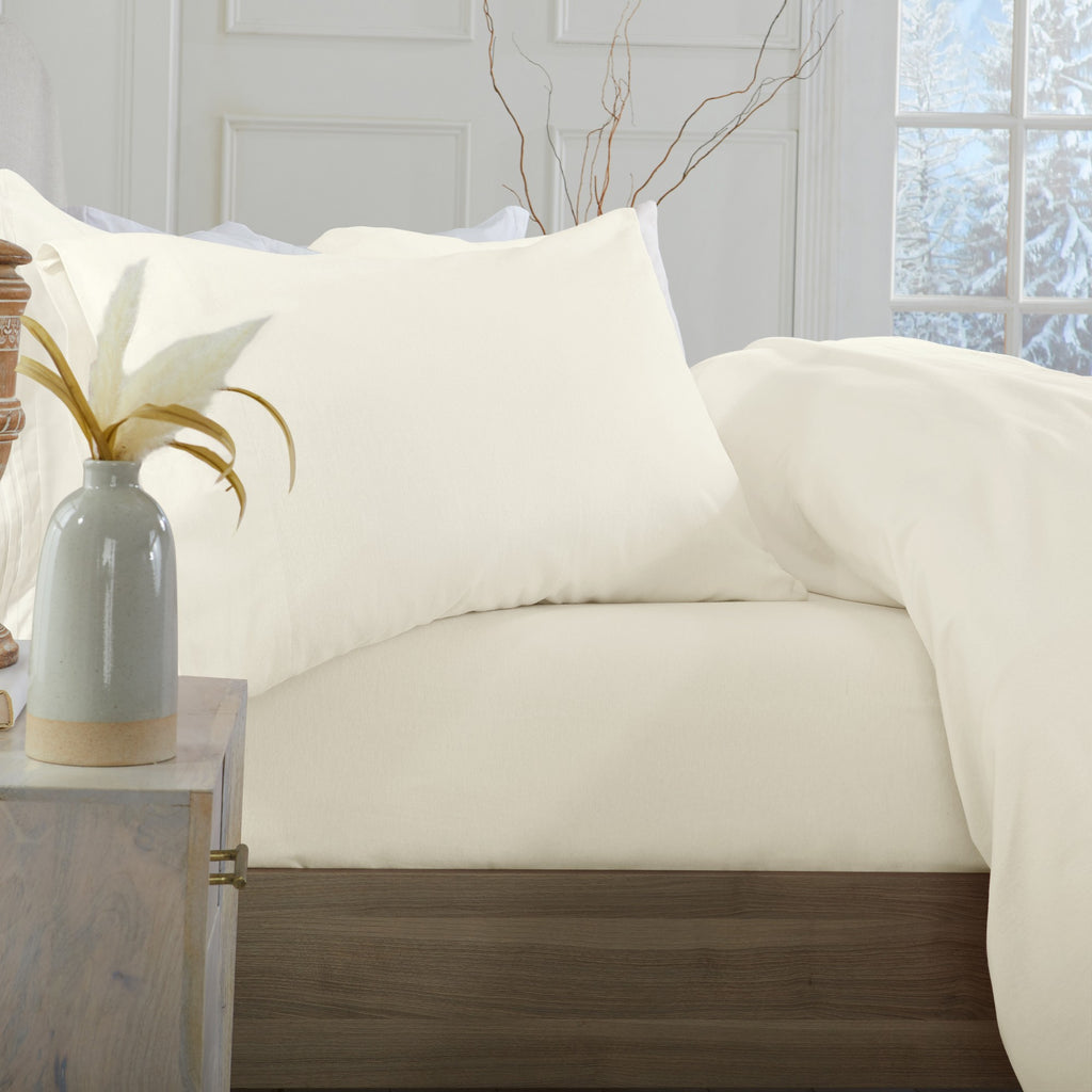 Chalet Collection Solid Flannel Sheet Set in assorted solid colors, featuring ultra-soft 100% Turkish cotton flannel bedding with coordinating pillowcases and fitted sheets, shown styled on beds and folded for detail views.