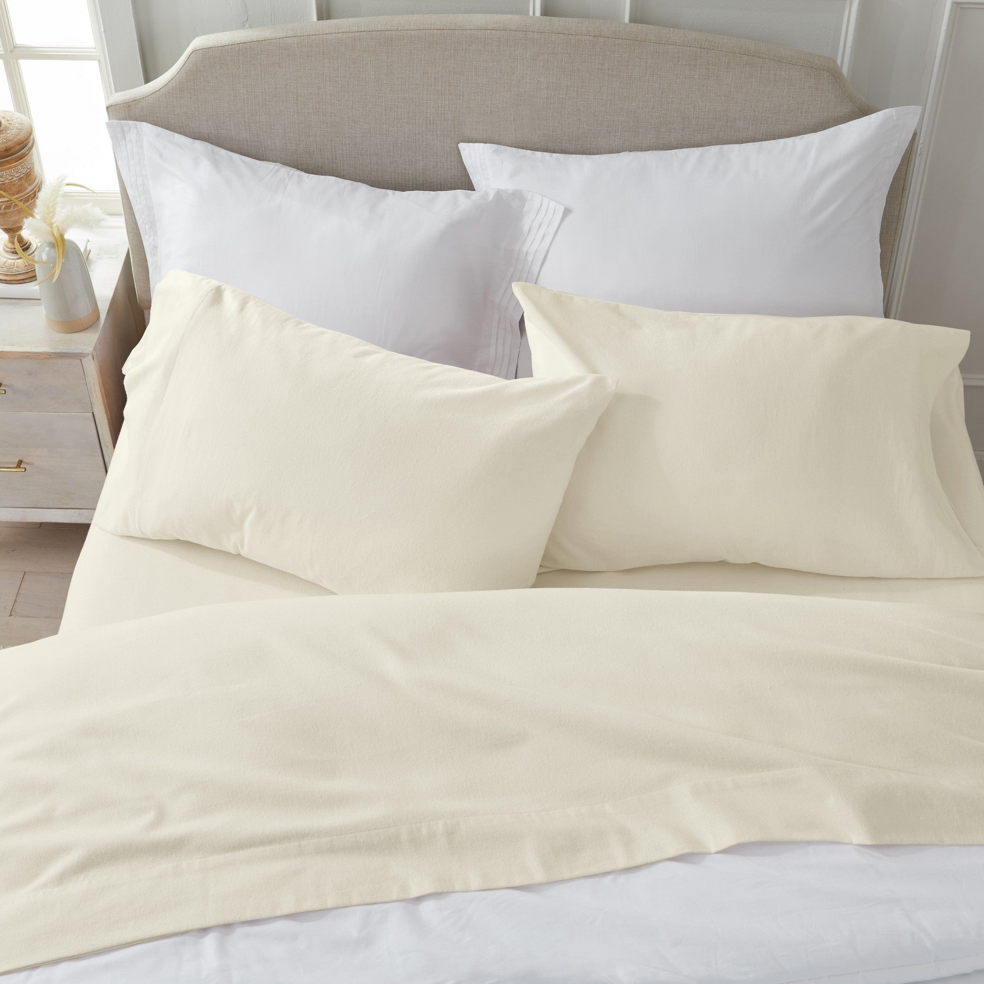 Chalet Collection Solid Flannel Sheet Set in assorted solid colors, featuring ultra-soft 100% Turkish cotton flannel bedding with coordinating pillowcases and fitted sheets, shown styled on beds and folded for detail views.