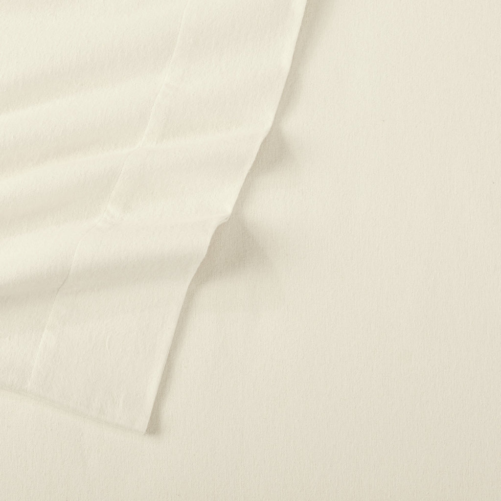 Chalet Collection Solid Flannel Sheet Set in assorted solid colors, featuring ultra-soft 100% Turkish cotton flannel bedding with coordinating pillowcases and fitted sheets, shown styled on beds and folded for detail views.