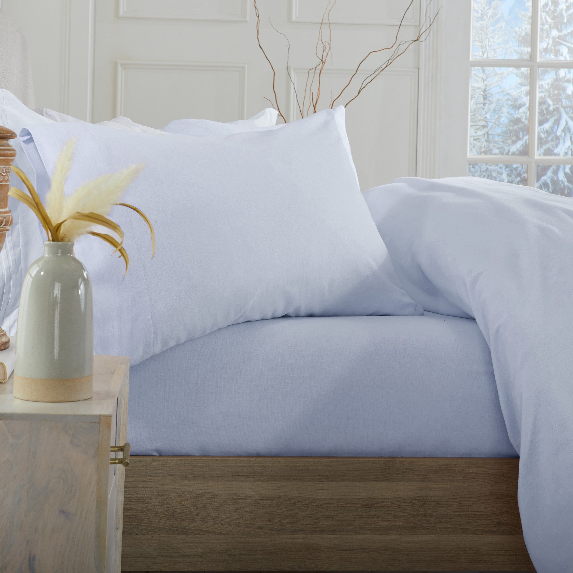 Chalet Collection Solid Flannel Sheet Set in assorted solid colors, featuring ultra-soft 100% Turkish cotton flannel bedding with coordinating pillowcases and fitted sheets, shown styled on beds and folded for detail views.