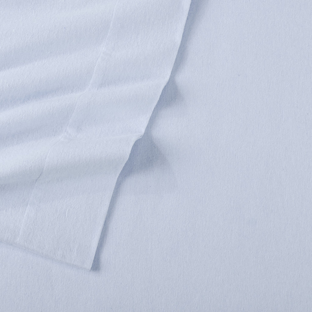 Chalet Collection Solid Flannel Sheet Set in assorted solid colors, featuring ultra-soft 100% Turkish cotton flannel bedding with coordinating pillowcases and fitted sheets, shown styled on beds and folded for detail views.