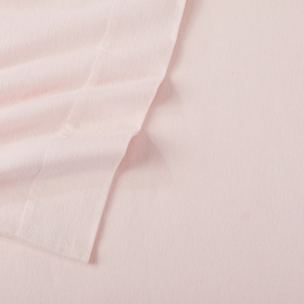 Chalet Collection Solid Flannel Sheet Set in assorted solid colors, featuring ultra-soft 100% Turkish cotton flannel bedding with coordinating pillowcases and fitted sheets, shown styled on beds and folded for detail views.