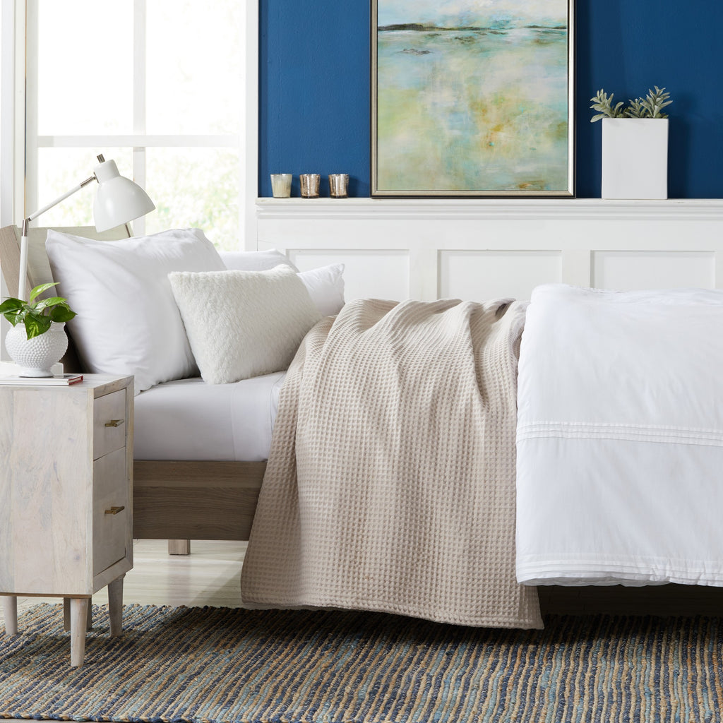 Brielle Collection Cotton Waffle Blanket by Market & Place featuring soft, breathable 100% cotton construction with a classic waffle weave texture. Available in multiple colors and shown folded, layered on beds, and in detailed fabric close-ups, highlighting its lightweight comfort and versatile year-round style.