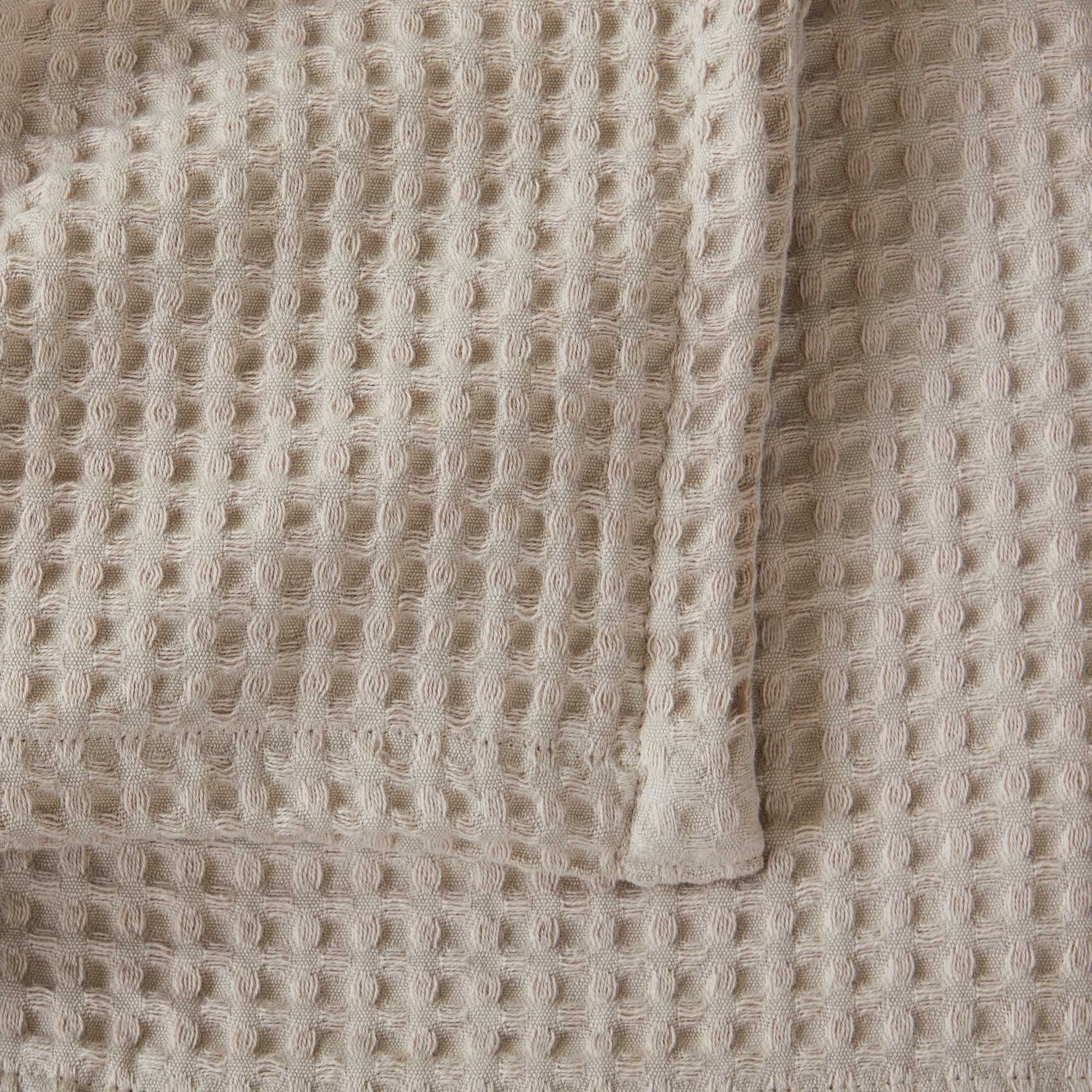 Brielle Collection Cotton Waffle Blanket by Market & Place featuring soft, breathable 100% cotton construction with a classic waffle weave texture. Available in multiple colors and shown folded, layered on beds, and in detailed fabric close-ups, highlighting its lightweight comfort and versatile year-round style.