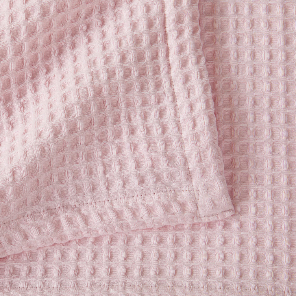 Brielle Collection Cotton Waffle Blanket by Market & Place featuring soft, breathable 100% cotton construction with a classic waffle weave texture. Available in multiple colors and shown folded, layered on beds, and in detailed fabric close-ups, highlighting its lightweight comfort and versatile year-round style.